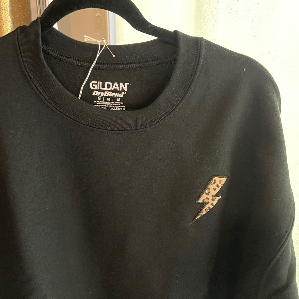 NWOT - Black sweatshirt with lighting outline and leopard embroidery.